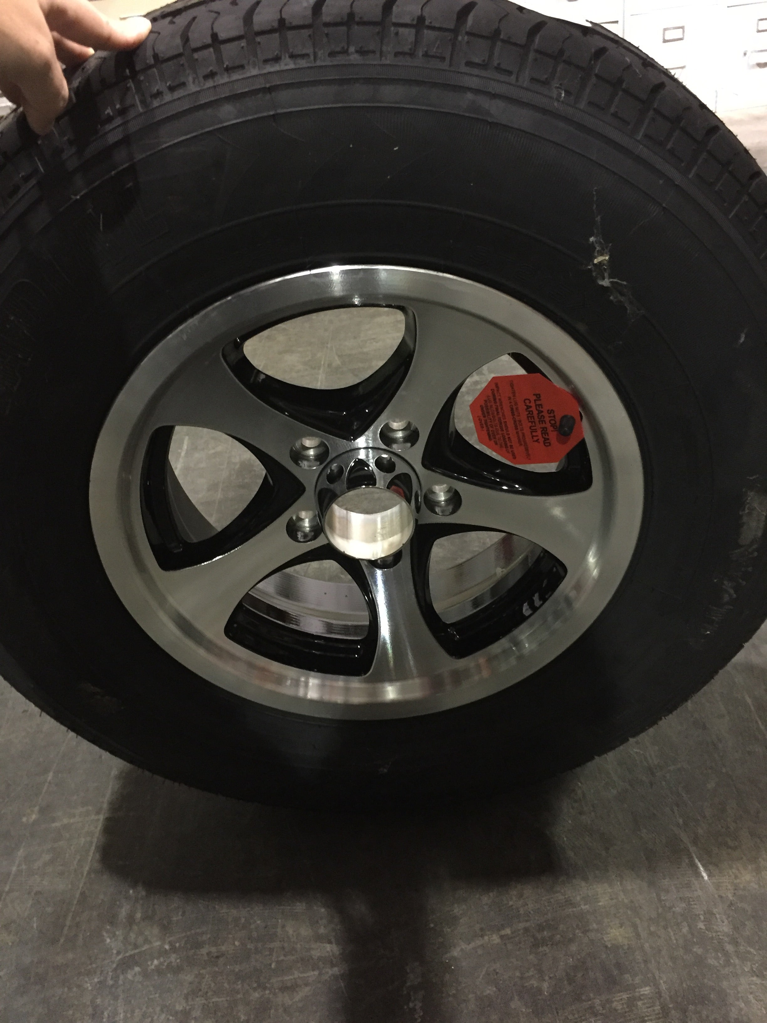 "WHEEL/TIRE-14"" BLACK MACHNXT 2200LB 8PLY TIRE '15"