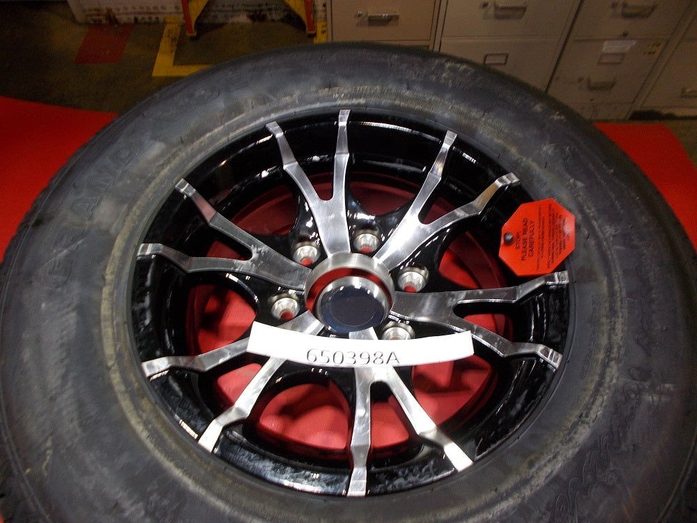 Replaced by Part# 650398B : "TIRE-ASSY 15"" BLK V-SPK 2830LB 10 PLY GRAND RIDE '15"