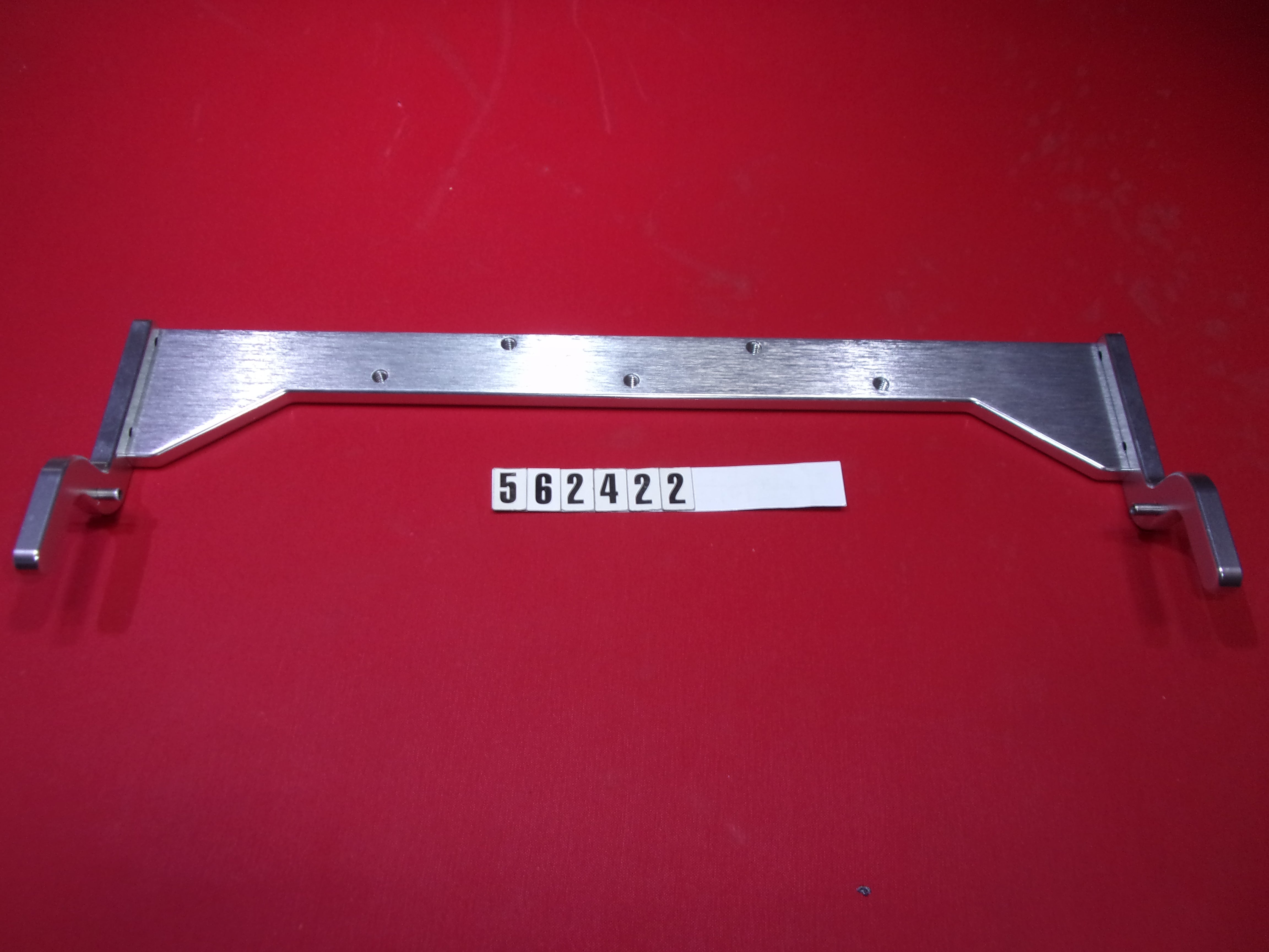 Replaced by Part# 562422A : BRACKET-BOW LID CATCH ALUM. '14 NLA