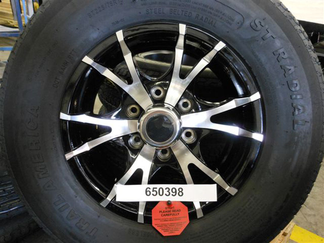 Replaced by Part# 650398B : "TIRE-ASSY 15""BLK 5-SPOKE 6 LUG W/10 PLY ST215/75R"