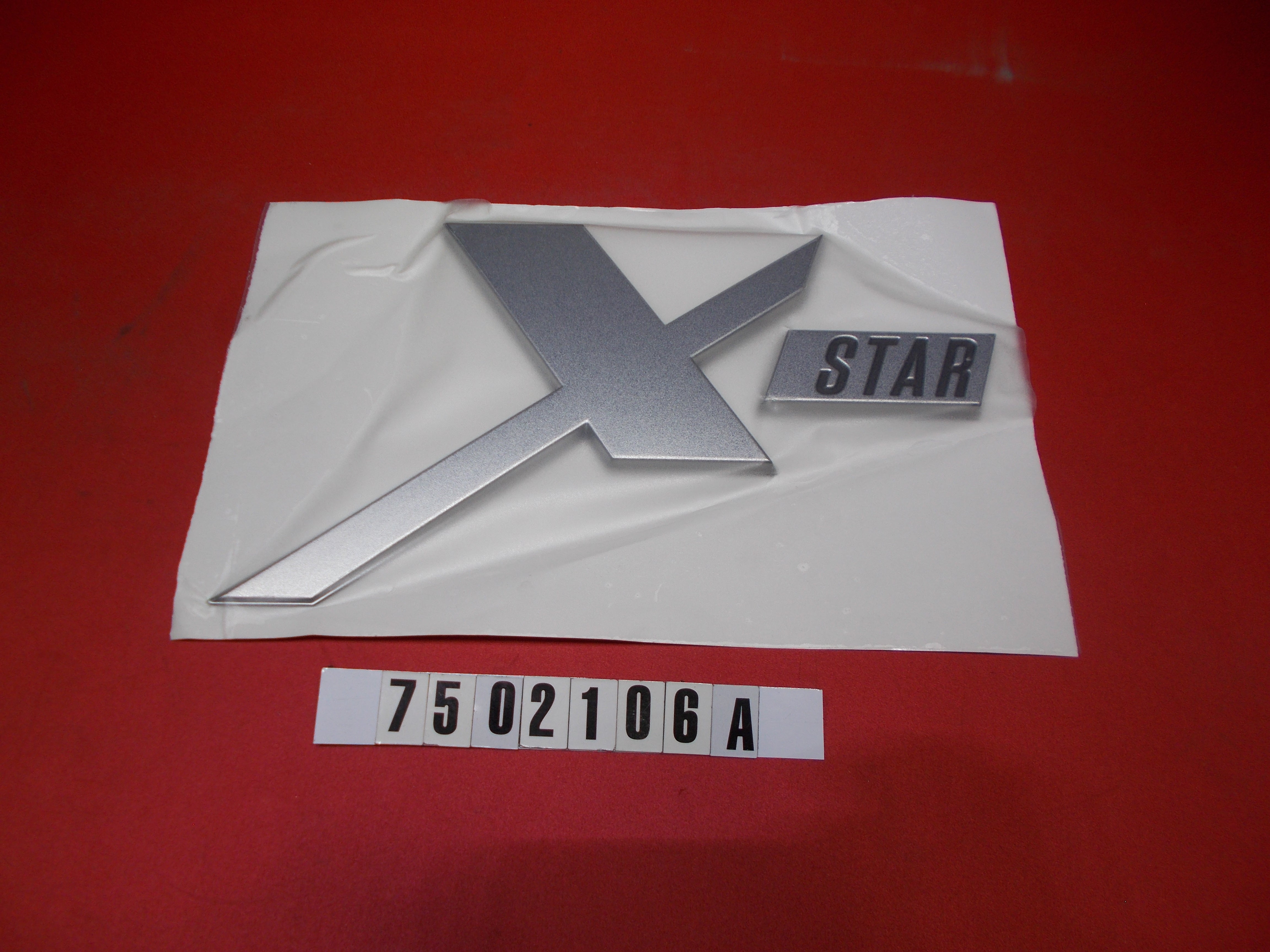 DECAL - DESIGNATOR XSTAR SATIN CHROME '18